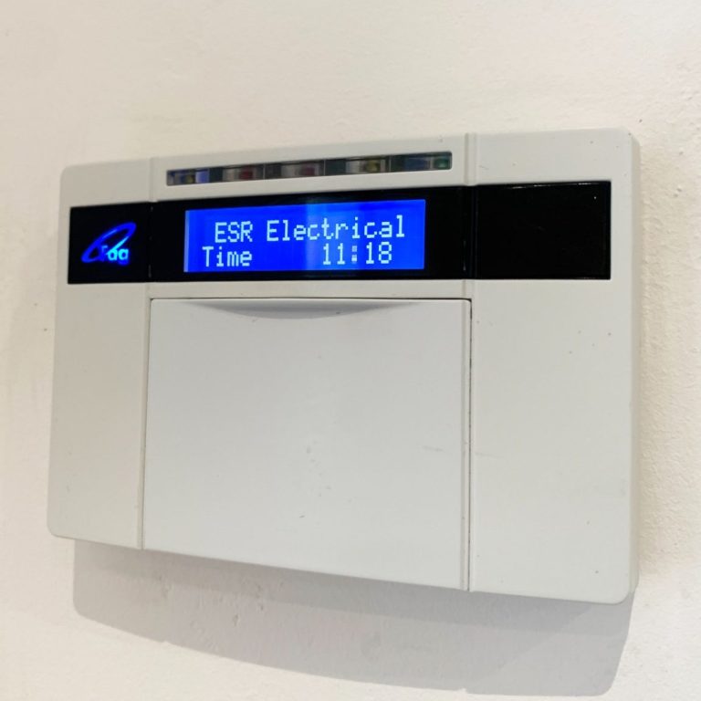 intruder alarm keypad which shows the company name of the installer "ESR Electrical"