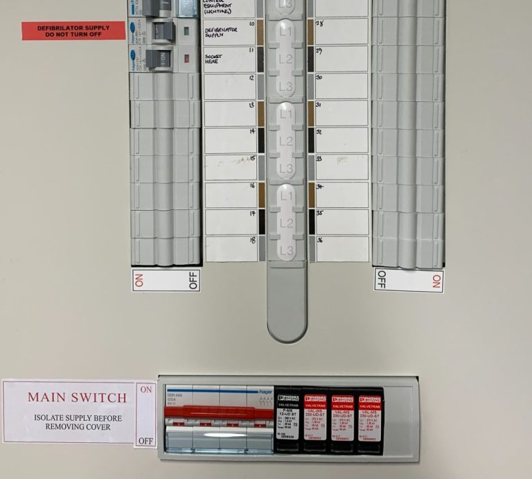 three phase distribution board complete with four pole main switch, some RCBO's and surge protection.