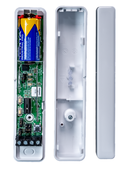 wireless intruder alarm sensor with it's lid removed to show battery and extra zone connection terminals inside